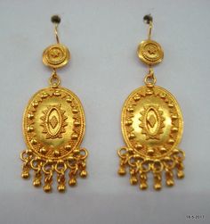 ethnic sterling silver gold vermeil gold gilded earring pair from rajasthan india. nice handmade design good for jewelry collection.long max.- 6.2 cm(2.4")width max.- 2 cm(0.8")weight - 16 gramsmaterial - Good Silver with gold plate. Festive 22k Yellow Gold Chandelier Earrings, Ceremonial 22k Gold Drop Earrings, 22k Gold Ceremonial Drop Earrings, Traditional 22k Gold Pierced Jewelry, Traditional 22k Gold Jewelry, 22k Gold Drop Earrings For Ceremonial Occasions, Traditional Pierced Yellow Gold Jewelry, 22k Gold Dangle Earrings With Intricate Design, Gold Plated Latkans Temple Earrings