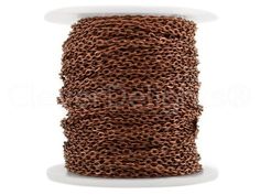 a spool of brown rope on a white background