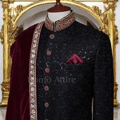 Feel ultimate sophistication with this stunning jet black sherwani. Chiseled in sumptuous embroidered fabric, the masterpiece is further beautified with shimmering sequins and intricate hand embellishments to make one look dapper on his special day. The multi-colored hand embellishment adds a touch of traditional charm with the edge of being contemporary. Complementing this, we have sewn in a self-designed turban of maroon color and a khussa coinciding with that of the outfit so that you befit a Black Sherwani Groom, Black Sherwani, Sherwani For Groom, Black Tuxedo Suit, Waistcoat Designs, Hand Embellishment, Sherwani For Men Wedding, Embroidered Sherwani, Prince Coat