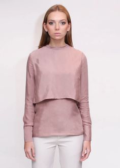 Pre-Order - Shipments start August 30th. The tiered layers of this blouse drape elegantly in dusty rose as the high neckline is gathered in the back with self tie and buttons down the length of the garment. Tailored sleeves and long cuffs complete the look with structure and elevated ease. Blouse, reverse button down c Elegant High Neck Ruffle Top, Elegant High Neck Top With Ruffles, Chic High Neck Top With Ruffles, Chic Mauve Tops For Fall, Feminine Long Sleeve Blouse For Layering, Spring Elegant Long Sleeve Mock Neck Top, High Neck Spring Blouse, Feminine High Neck Blouse For Spring, Elegant Spring Long Sleeve Mock Neck Top