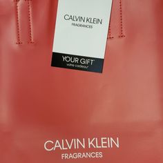 This Is A Loyalty Gift From Calvin Klein Fragrances. It Is A Simple Shopping Tote With A "Wristlet" That Is Fixed To The Handles (Sort Of An External Compartment). It Still Has The Tags With The Original Wrapping. This Item Is In Brand New Condition. For Measurements Or For More Pictures, Please Message Me. I'd Be More Than Happy To Help :) Calvin Klein Fragrance, Shopping Tote, Womens Calvin Klein, Womens Tote Bags, Red Color, Calvin Klein, Handles, Black And Red, Fragrance