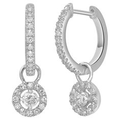 Make a stunning impression with these drop hoop earrings made with 14k white gold and genuine diamonds These lobe-hugging earrings have a lovely circular pattern that descends down and moves with the wearer. These snap-post earrings are studded with 0.33 carats of round full-cut and single-cut diamonds. Please follow the Luxury Jewels storefront to view the latest collections & exclusive one of a kind pieces. Luxury Jewels is proudly rated as a Top Seller on 1stDibs with all 5 star customer revi White Gold Dangle Earrings With Halo, White Gold Halo Dangle Earrings, Fine Jewelry Diamond Dangle Earrings With Halo Setting, Diamond Dangle Hoop Earrings Fine Jewelry, Dangle Diamond Hoop Earrings Fine Jewelry, Diamond Huggie Earrings With Prong Setting In Dangle Style, White Gold Dangle Huggie Earrings Fine Jewelry, Wedding Diamond Dangle Huggie Earrings, White Gold Halo Design Dangle Diamond Earrings