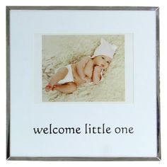 a baby in a diaper is laying down with the words welcome little one