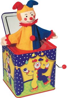 a stuffed toy clown sitting on top of a box with an open lid and door