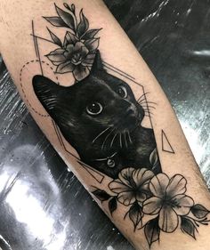 a black cat with flowers on it's head and an arrow in the middle