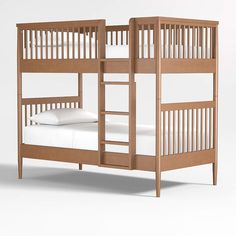 a wooden bunk bed with white sheets and pillows on it's bottom level, against a plain background