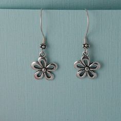 Cute silver plated flower earrings that hang on high quality Sterling silver ear wires. One of my favorite flowers. Comes wrapped ready for gift giving. Sterling Silver Flower Earrings For Mother's Day, Mother's Day Nickel-free Sterling Silver Flower Earrings, Mother's Day Silver Sterling Flower Earrings, Silver Flower Earrings For Mother's Day, Sterling Silver Flower Pendant Earrings As Gift, Mother's Day Sterling Silver Flower Earrings, Sterling Silver Flower Charm Earrings, Sterling Silver Flower Charm Earrings As Gift, Handmade Silver Flower Earrings For Mother's Day