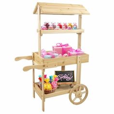 a wooden cart filled with lots of candy