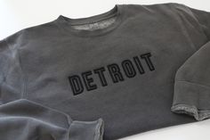 Shown as DETROIT but pick any word to be embroidered in 3D and all caps.  3D Embroidered  Independent Trading Company midweight crew 80% cotton, 20% polyester  Waahed Black Crew Black Thread  XS - 2XL These sweatshirts are pigment dyed so all will vary slightly Embroidered T-shirt For Winter Streetwear, Streetwear Crew Top With Embroidered Logo, Custom Embroidered Tops For Streetwear, Cotton Sweatshirt With Embroidered Logo For Streetwear, Sporty Custom Embroidered Tops For Streetwear, Sporty Embroidered Top For Streetwear, Sporty Custom Embroidery T-shirt For Streetwear, Sporty T-shirt With Custom Embroidery, Custom Embroidered Cotton Tops For Streetwear