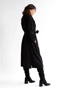 Timeless Long Black Wool Overcoat with a modern twist. Proudly Made in the USA from 100% RWS certified + NATIVA Regen™ domestic wool. Ethically sewn in Chicago, IL. Recommended for temperatures ranging from 5 to 35 degrees Fahrenheit. Fully lined for warmth and quality. Combines style and sustainability. Double back walking vent for mobility. On-seam belt vents for versatile styling options. Deep on-seam pockets for carrying essentials. Single horn snap closure reinforced with magnetic closures Modern Black Wool Coat For Work, Tailored Black Wool Long Coat, Modern Black Wool Coat With Long Sleeves, Modern Black Wool Long Sleeve Coat, Modern Black Long Sleeve Wool Coat, Modern Tailored Black Wool Coat, Modern Black Wool Coat, Modern Black Wool Coat For Fall, Black Wool Long Sweater Coat