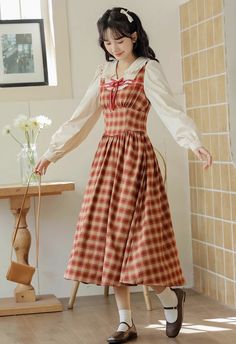 Faux two-piece midi dress with a frilly peter pan collar, ribbon details, long puff sleeves and plaid pinafore bodice. Concealed side zipper. S: 35" chest, 26" waist, 44" lengthM: 36.5" chest, 27.5" waist, 44" lengthL: 38" chest, 29" waist, 44.5" lengthXL: 39.5" chest, 30.5" waist, 44.5" length Fall Plaid Dress With Square Neck, Casual Plaid Dress With Square Neck For Fall, Casual Square Neck Plaid Dress For Fall, Fall Gingham Plaid Midi Dress, Fall Cottagecore Dress With Doll Collar, Fall Plaid Midi Dress, Fall Plaid Long Sleeve Dress With Ruffles, Fall Gingham Plaid Dress With Ruffles, Long Sleeve Plaid Dress With Ruffles For Fall