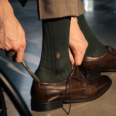 Eco-Chic Elegance in Every Step.Elevate your sock game with our ribbed Vanise Mid Calf Green Dress Socks. Crafted from organic Nilo cotton with a touch of nylon for elasticity, these green dress socks offer unmatched comfort and a perfect fit. The ribbed design not only enhances the visual appeal but also provides a snug yet flexible fit, ensuring that these socks stay comfortably in place throughout the day. The mid-calf length strikes the perfect balance, allowing them to pair effortlessly wit Classic Ribbed Socks, Classic Ribbed Fitted Socks, Classic Fitted Ribbed Socks, Classic Fitted Socks For Fall, Classic Fitted Cotton Socks, Socks Photography, Pretty Body, 2024 Lookbook, Men's Dress Socks