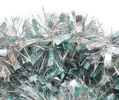 a pile of silver and green glass shards