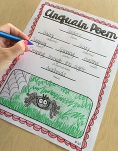 a person holding a pencil in front of a paper with writing on it and spider web