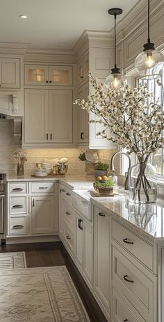 a kitchen with white cabinets and an area rug on the floor that has flowers in it