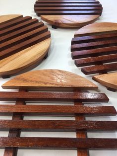 four pieces of wood sitting on top of a table