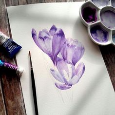 a watercolor painting of purple flowers on paper next to paintbrushes and paints