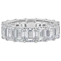 A gorgeous eternity wedding band, showcasing emerald cut diamonds weighing 12.48 carats total, set in an open-gallery setting. Each diamond is certified by GIA as G-H color and IF-VS1 clarity. Finely made with platinum.  Roman Malakov is a custom house, specializing in creating anything you can imagine. If you would like to receive a special quote on a custom piece, please message or call us. Emerald Cut Diamond Eternity Band, Wide Diamond Bands, Diamond Eternity Wedding Band, Platinum Wedding Band, Platinum Wedding, Emerald Cut Diamond, Eternity Band Ring, Eternity Wedding Band, Eternity Band Diamond