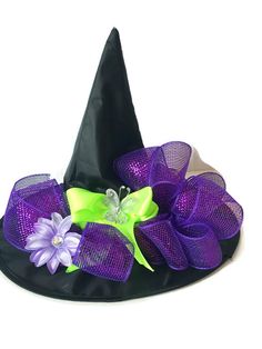 a witches hat with purple and green flowers