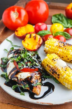 grilled corn on the cob with tomatoes and other vegetables