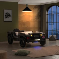 a bedroom with an off road vehicle bed in the middle and a large window behind it