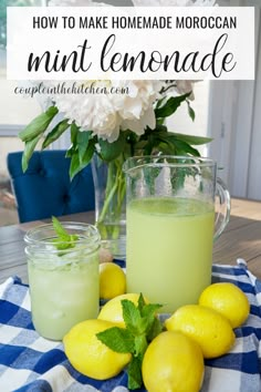 some lemons and limeade are sitting on a table with flowers in the background