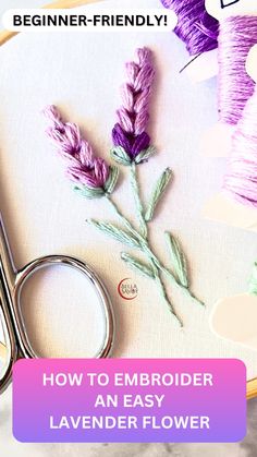 a pair of scissors sitting on top of a table next to some yarn and flowers