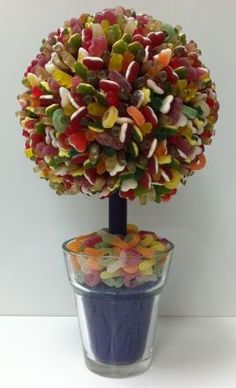 a tree made out of gummy bears in a vase