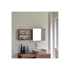 a bathroom with a sink, mirror and shelves on the wall