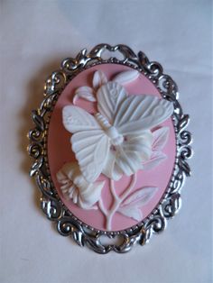 "It has a beautiful Large pink & white butterfly Cameo.The brooch is 2\" ( 5 cm) in length and on the back you have a silver tone brooch clasp. Combined shipping on multiple items." White Cameo Brooches For Wedding, White Cameo Brooch For Wedding, White Cameo Brooches For Formal Occasion, White Cameo Brooch For Formal Occasions, White Cameo Wedding Brooches, Victorian Pink Brooches For Wedding, Victorian Style White Cameo Brooches, Victorian Style White Cameo Brooch, Elegant Pink Brooches For Collectors