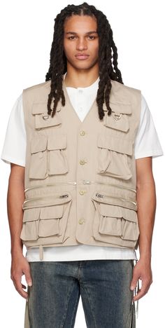 Cotton-blend canvas vest. · Y-neck · Button closure · Zip and bellows pockets · D-ring hardware at chest and back collar · Logo graphic embroidered at back collar · Zip pocket and logo embroidered at back hem · Integrated logo strap at interior · Full mesh lining · Logo-engraved silver-tone hardware Supplier color: Sand Multi Pocket Vest, Canvas Vest, Pocket Vest, Textile Logo, French Terry Hoodie, Color Sand, Logo Pattern, Bellows, Collar And Cuff