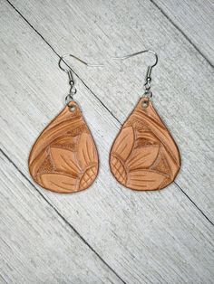 Hey, I found this really awesome Etsy listing at https://www.etsy.com/listing/719911879/teardrop-sunflower-tooled-leather Handmade Brown Faux Leather Earrings, Handmade Teardrop Faux Leather Earrings, Hand Tooled Brown Earrings For Everyday Wear, Brown Dangle Flower Earrings For Pierced Ears, Brown Hand Tooled Everyday Earrings, Brown Dangle Flower Earrings, Everyday Leather Teardrop Earrings, Brown Flower Drop Earrings, Beige Leather Jewelry