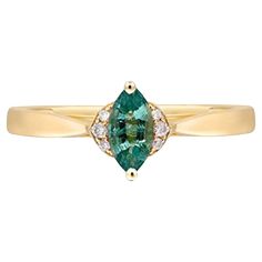 Decorate yourself in elegance with this Ring is crafted from 14-karat Yellow Gold by Gin & Grace. This Ring is made up of 7x3.5 mm Marquise-Cut Emerald (1 pcs) 0.29 carat and Round-cut White Diamond (6 Pcs) 0.04 Carat. This Ring is weight 1.41 grams. This delicate Ring is polished to a high finish shine. Gin And, Chinese Art Deco, Zambian Emerald, Delicate Rings, Zambia, Marquise Cut, Emerald Ring, Jewelry Rings Engagement, White Diamond