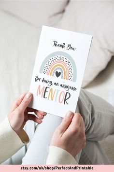 someone holding up a card that says, thank you got being an awesome mentor and rainbow