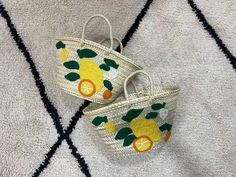 Prepare for summer with our lively Summer Lemon Bag. This beach tote features hand-embroidered lemons on a straw base, infusing your holiday wardrobe with a hint of Italian elegance. Crafted from premium-quality straw, the Lemon Beach Bag is both stylish and functional, perfect for carrying all your beach or poolside necessities. Its roomy interior offers plenty of space for towels, sunscreen, snacks, and more, making it the ideal summer tote. Our Italy Inspired Tote. The lemon embroidery brings Lemon Embroidery, Lemon Bag, Prepare For Summer, Large Weekender Bag, Summer Shopping, Summer Tote, Bag Summer, Bridal Shower Gift, Holiday Wardrobe