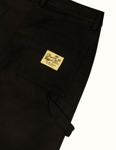 Our workwear pant in a loose fit, constructed of cotton with a little bit of stretch for added comfort. These pants have a longer Front Rise than normal so the Inseam starts a little lower than average All heights can comfortably wear the 30'' Inseam due to a scaling up Front Rise 98% Cotton / 2% Elastane Spandex Loose Fit Pre-Shrunk Pre-washed and will continue to get softer with future washes Back pocket woven label Wash cold with similar colors, dry on delicate setting Fits Loose In Hips / Le Black Workwear Bottoms With Patch Pockets, Workwear Pants With Patch Pockets And Standard Cut Leg, Black Jeans With Patch Pockets For Work, Tapered Leg Chinos With Side Pockets For Streetwear, Baggy Cotton Pants For Work, Cotton Utility Work Pants With Side Pockets, Relaxed Fit Cotton Work Pants With Belt Loops, Utility Straight Leg Chinos For Streetwear, Utility Style Straight Leg Chinos For Streetwear