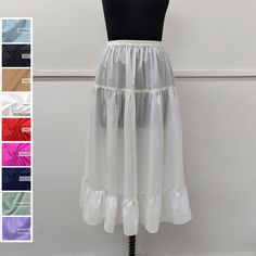 Discover the timeless allure of the cotton ruffle half slip. Crafted from high-quality cotton, it offers comfort and elegance. Perfect for a seamless silhouette, it adds a layer of modesty to skirts and dresses. Embrace classic style with this versatile wardrobe essential. Cotton Underskirt / Cotton Petticoat / Cotton Half Slip / Cotton Dress Liner ➡️Sale for 1 Half Slip ➡️100 % Light Weight Cotton.. ➡️Care: Hand wash in cold water. Do not bleach.  ➡️Available sizes : (Measurements are of garment only) X-SMALL- Fits US Size 0-2 (Elastic waistband 21.5" inch relax to 24.5" inch stretched, Hip 35" inch). SMALL- Fits US Size 2-4 (Elastic waistband 23" inch relax to 27" inch stretched, Hip 38" inch). MEDIUM- Fits US Size 6-8 (Elastic waistband 27" inch relax to 32" inch stretched, Hip 42" inch White Ruffled Skirted Petticoat, Daywear Ruffled Petticoat, Daywear Ruffled Tiered Skirt Petticoat, Daywear Tiered Skirt Petticoat With Ruffles, Daywear Tiered Petticoat With Ruffles, Cotton Petticoat With Gathered Skirt For Daywear, Daywear Tiered Gathered Petticoat, White Cotton Petticoat With Attached Cancan, Fitted Ruffles Petticoat For Daywear