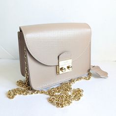 Lloyd Leather Front Flap Chain Strap Crossbody Shoulder Bag New Italy Beige Textured Leather. Gold Tone Push Clasp Closure. Made In Italy New With Tags! L 6 3/4" H 5.5" D 3" Chain Drop: 22" Carry As A Clutch, Just Hide The Chain Within The Bag As You Carry Everyday Luxury Flap Bag With Chain Strap, Classic Clutch Satchel With Chain Strap, Classic Leather Bag With Gold Chain, Leather Clutch Bag With Gold Chain, Leather Clutch With Gold Chain, Elegant Leather Bags With Gold Chain, Classic Everyday Flap Bag With Chain Strap, Classic Satchel With Chain Strap For Daily Use, Gold Leather Satchel With Chain Strap