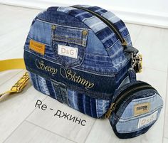 a denim bag with zippers on the front and side, sitting on top of a white tile floor