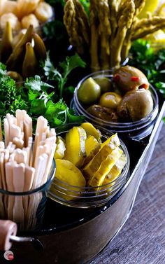 several bowls filled with different types of food