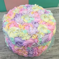 there is a cake that has been decorated with flowers on the top and bottom layer