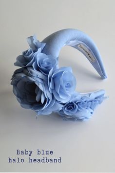 ◆ Dusty blue wedding guest headband hat. Floral headpiece for wedding inspired by Kate Middleton. Baby blue fascinator hat for women is hand made and hand stitched.◆ Padded halo headband has been covered in dusty blue fabric. Halo crown headpiece has been trimmed with flowers and leaves covering the right ear side. Modern and elegant flower crown for adult will instantly elevate any outfit.◆ The fascinator headband is unique work. One size Adjustable Blue Headband For Spring, Light Blue Headpieces For Spring Wedding, Summer Blue Headpiece With Handmade Flowers, Spring Blue Fascinator For Garden Party, Blue Spring Fascinator For Garden Party, Spring Blue Mini Hats With Handmade Flowers, Blue Headpieces For Spring Weddings, Blue Headpieces For Summer Garden Party, Blue Mini Hat Headband For Spring