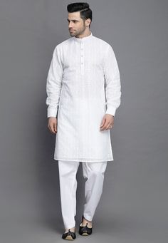 Faux Georgette Kurta in White.This Readymade attire is Enhanced with Buttons and Resham Work. Crafted in Chinese Collar Neck and Full Sleeve.Available with a Cotton Pant in White. Do note: Footwear shown in the image is for presentation purposes only. Half to one inch may vary in measurement. (Slight variation in actual color vs. image is possible). We sell all kinds of menswear. Mens Kurta | Mens Kurta Pajama | Mens Sherwani | Mens Sherwani Sets | Traditional Menswear | Partywear Menswear | Ind White Unstitched Traditional Wear With Cutwork, Elegant White Traditional Wear With Cutwork, White Cotton Traditional Formal Wear, Formal White Cotton Traditional Wear, Elegant White Kurta With Cutwork, Elegant White Cutwork Kurta, Traditional White Cutwork Sets, Fitted White Cutwork Sets, White Traditional Wear With Self Design For Formal Occasions