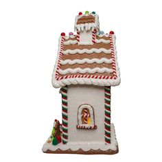 a gingerbread house ornament on a white background