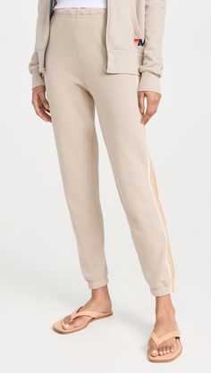 Fast Free Shipping & Free Returns on Aviator Nation 5 Stripe Women's Sweatpants at Shopbop. Shop new arrivals from Aviator Nation at Shopbop.com Casual Cotton Bottoms With Signature Stripes, Striped Sporty Sweatpants For Loungewear, Sporty Striped Sweatpants For Loungewear, Striped Bottoms For Fall Loungewear, Striped Cotton Sweatpants For Loungewear, Sporty Striped Pants For Loungewear, Athleisure Loungewear Pants With Contrast Stripes, Athleisure Lounge Pants With Contrast Stripes, Athleisure Sweatpants With Contrast Stripes For Loungewear