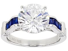 Bella Luce ® 7.39ctw 10mm Round White Diamond Simulant with 2.5mm Lab Spinel And White Diamond Simulant Rhodium Over Silver Ring. Measures Approximately 0.85"L x 0.39"w, Shank 0.10"W, Not Sizable. The Diamond Equivalent Weight is 4.41ctw. Round Lab-created Sapphire Jewelry With Channel Set, Round Channel Set Lab-created Sapphire Jewelry, Channel Set Lab-created Sapphire Ring, Cubic Zirconia Channel Set Sapphire Ring, Round Cut, Classic Channel Set Lab-created Sapphire Jewelry, Man Made Diamonds, Diamond Simulant, Gemstone Colors, Natural Crystals