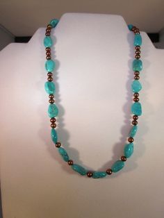 Genuine Sleeping Beauty Turquoise from Arizona is paired with beautiful freshwater cultured chocolate brown pearls to make a one of a kind necklace!  The necklace is the perfect length at 18".  These stones & pearls look just fabulous together!!  It is finished with a designer toggle clasp in brass from Sakisilver, easy to take on & off.  Beautiful chocolate to copper color coin freshwater pearls with great iridescence & shimmer are strung with larger genuine Arizona turquoise nuggets from the Sleeping Beauty Mine in between to give this necklace an amazing look to get you noticed! The Sleeping Beauty Mine located in Globe, AZ is world famous for producing some of the best turquoise. The nacre finish on these pearls is just beautiful reflects every hue from chocolate to cognac to copper - Gift Turquoise Necklace With Polished Brown Beads, Gift Brown Turquoise Necklace With Polished Beads, Globe Az, Brown Pearl Necklace, Brown Pearls, Beautiful Chocolate, Arizona Turquoise, Native American Culture, Sleeping Beauty Turquoise