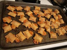 some food that is sitting on a baking sheet in the oven and ready to be cooked