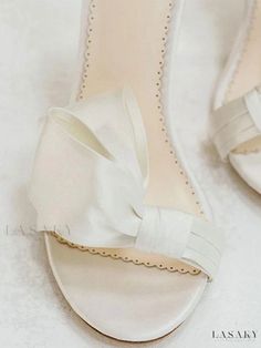 Lasaky - Satin White Bridal Sandals: Elegant Open Toe Design with Bow Embellishment, Ankle Strap, and Block Heel - Perfect for Parties and Weddings Elegant White Sandals For Wedding Guest, Elegant Open Toe Sandals For Bridal Shower, Elegant Low Heel Sandals For Wedding, White Low Heel Sandals For Wedding, White Sandals For Summer Ceremonies, White Summer Ceremony Sandals, White Low Heel Sandals For Bridal Shower, Summer Wedding Flat Heels, Elegant Flat White Wedding Shoes