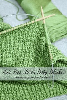 the knitting needles are next to some green knitted blankets and one has a name tag that reads, knit ricke stitch baby blanket